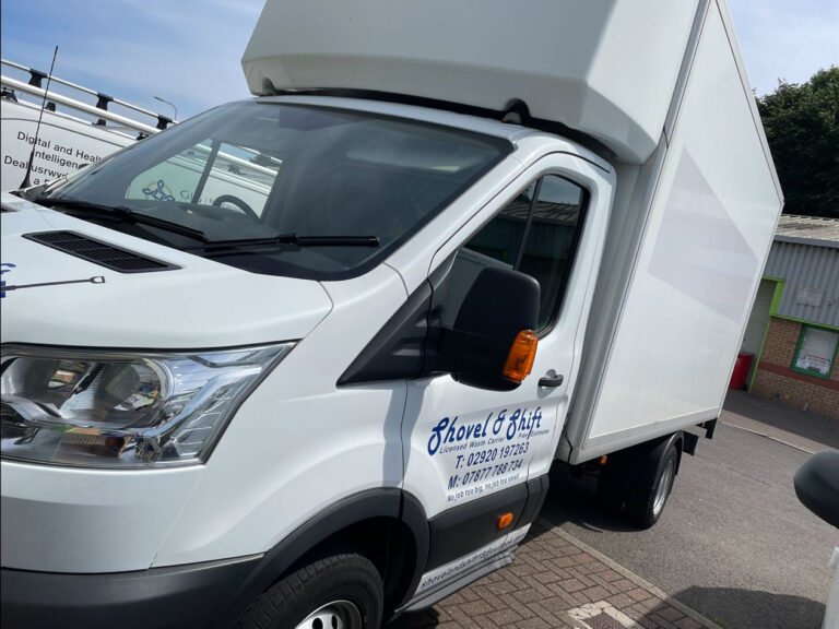 A white van parked in a parking lot.